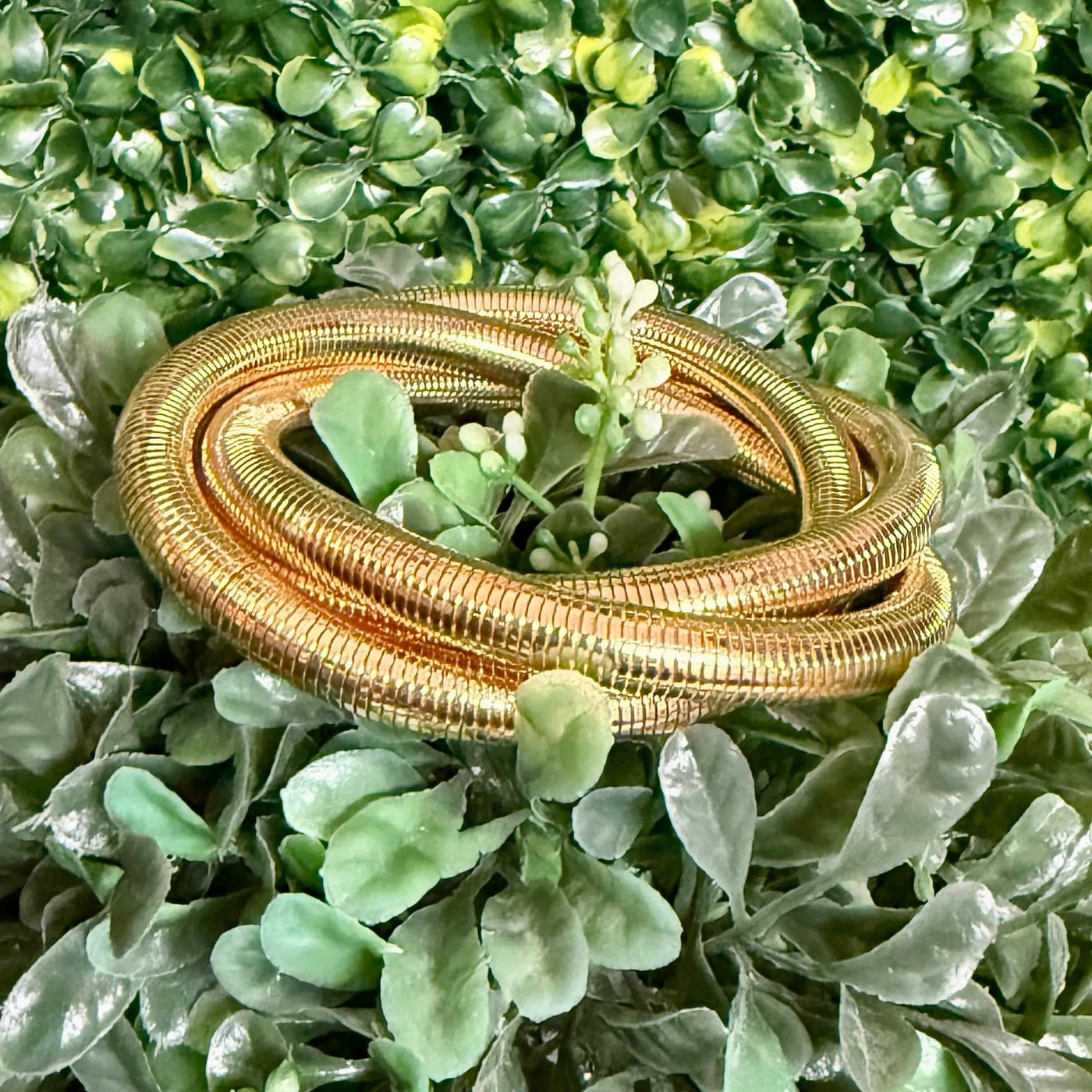 3 - Strand Slinky Style Goldtone Bracelet Shabby Chic Boutique and Tanning Salon