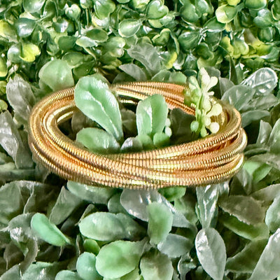 5 - Strand Slinky Style Goldtone Bracelet Shabby Chic Boutique and Tanning Salon