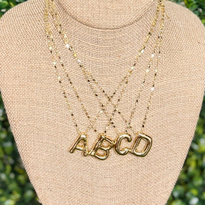 Goldtone Puff inital Necklace Shabby Chic Boutique and Tanning Salon