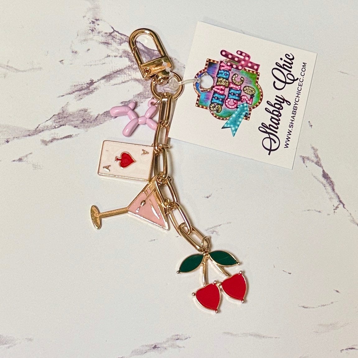 Purse Charms Shabby Chic Boutique and Tanning Salon Cosmo