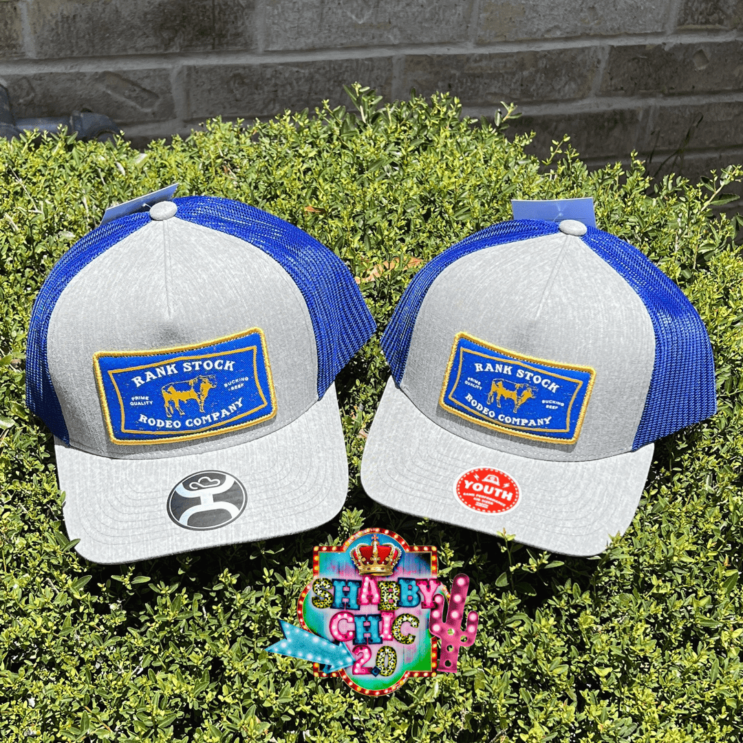 Hooey Rank Stock In Gray And Blue Five Panel Trucker With Blue Yellow And White Rectangle Patch Trucker Cap Shabby Chic Boutique and Tanning Salon